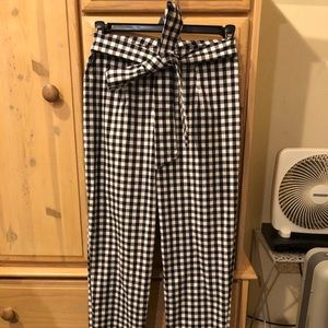 Black and White checked pants with tie.